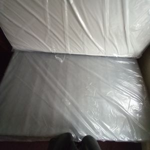 Brand new queen size bed set..mattress .boxspring..and railing